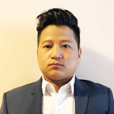 Portrait of Karna Rai, City Administrator at Decent Home Care.