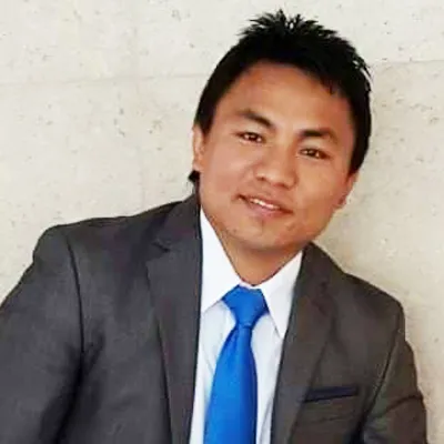 Portrait of Krishna Rai, State Administrator at Decent Home Care.